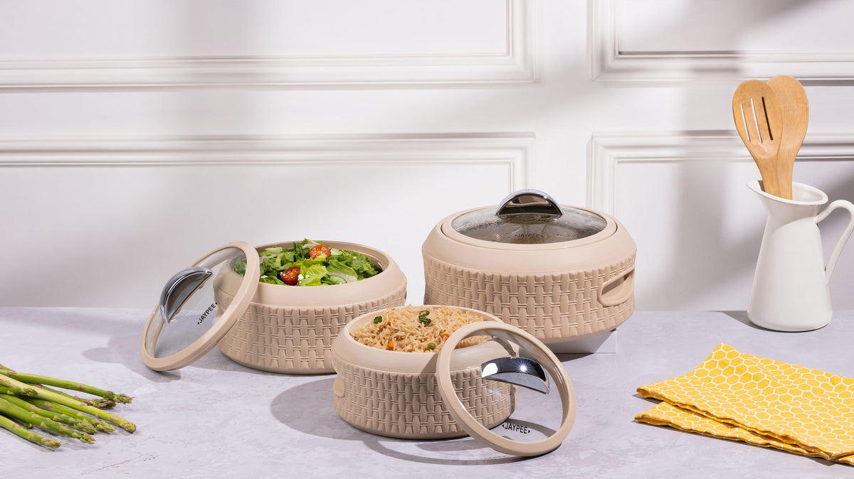 Jaypee insulated casserole served with salad on a kitchen table