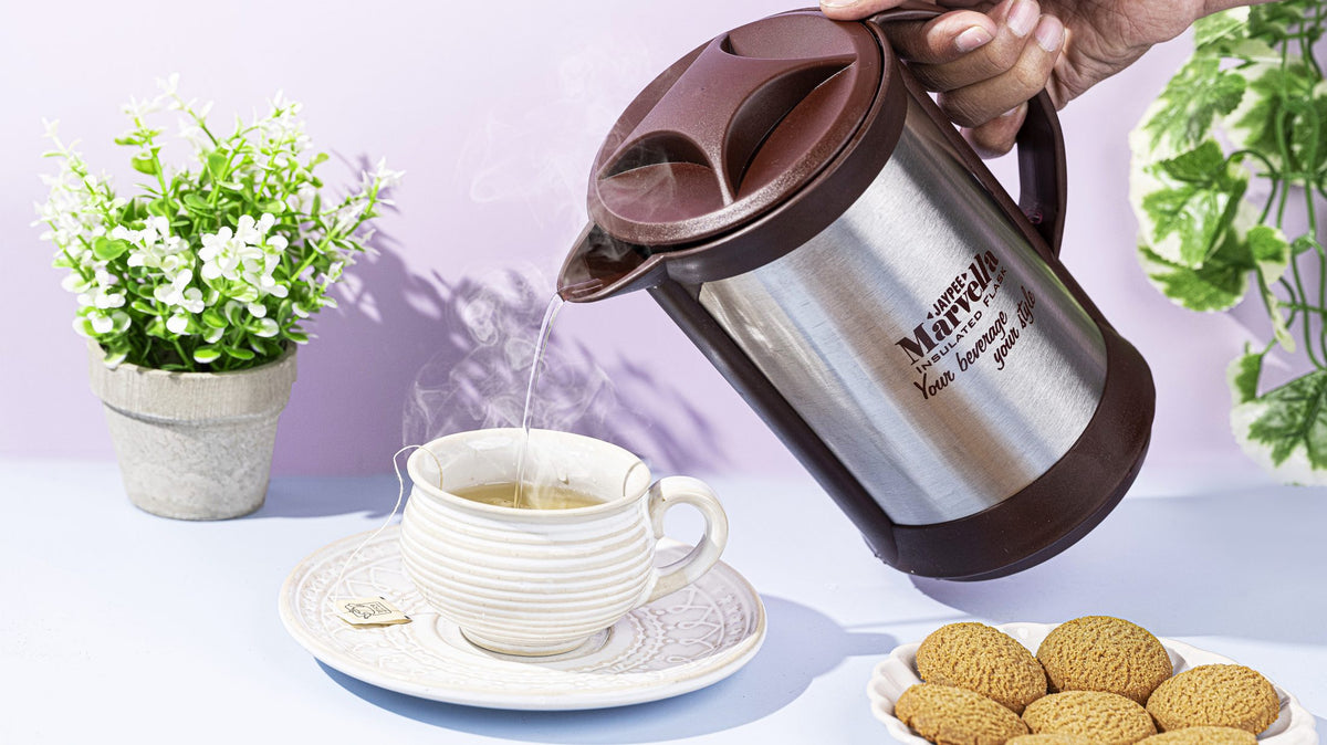 Pouring tea from a Jaypee insulated kettle